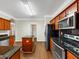 Bright kitchen with granite countertops, an island, and stainless steel appliances at 141 Whimsical Ct, Locust Grove, GA 30248