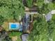 Bird's-eye view of house, pool, and surrounding neighborhood at 5513 N Peachtree Rd, Dunwoody, GA 30338