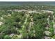 Aerial view showcases lush green surroundings and proximity to shops and community amenities at 5513 N Peachtree Rd, Dunwoody, GA 30338