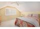 Bedroom with a ceiling fan and coral colored bedding at 5513 N Peachtree Rd, Dunwoody, GA 30338