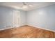 Bedroom with hardwood floors and white walls at 5513 N Peachtree Rd, Dunwoody, GA 30338