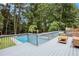 Spacious deck with tranquil pool and wooded backdrop views at 5513 N Peachtree Rd, Dunwoody, GA 30338