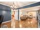 Elegant dining room with chandelier and view into living area at 5513 N Peachtree Rd, Dunwoody, GA 30338