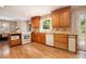 Modern kitchen with granite countertops and wood cabinetry at 5513 N Peachtree Rd, Dunwoody, GA 30338