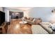 Spacious living room with hardwood floors and sectional sofa at 5513 N Peachtree Rd, Dunwoody, GA 30338