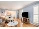 Light and airy living room with hardwood floors and ample natural light at 5513 N Peachtree Rd, Dunwoody, GA 30338