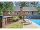 Relaxing backyard oasis with a swimming pool and lounge chairs at 5513 N Peachtree Rd, Dunwoody, GA 30338