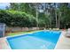 Relaxing pool area with plenty of space for lounging and entertaining at 5513 N Peachtree Rd, Dunwoody, GA 30338