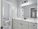 Modern bathroom with white cabinets and marble countertops at 6091 Wayfarer Dr, Villa Rica, GA 30180