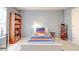 Bright bedroom with bookcase and sports bedding at 8919 Elina Rose, Douglasville, GA 30134