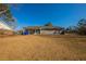 Rear view of a ranch house with covered patio at 100 Glace Rd, Atlanta, GA 30349