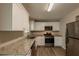 Well-equipped kitchen with granite countertops and stainless appliances at 100 Glace Rd, Atlanta, GA 30349