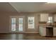 Eat-in kitchen with French doors leading to the backyard at 100 Glace Rd, Atlanta, GA 30349
