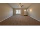 Bright living room featuring a large window and ceiling fan at 100 Glace Rd, Atlanta, GA 30349