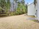 Spacious backyard with grassy area and trees at 4676 Ravenwood Loop, Union City, GA 30291