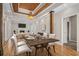 Spacious dining room with hardwood floors and a modern chandelier at 3542 Linecrest Rd, Ellenwood, GA 30294