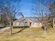 Brick ranch house with a landscaped lawn and mature trees at 3542 Linecrest Rd, Ellenwood, GA 30294