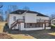 House exterior with deck, stairs, and screened porch at 3542 Linecrest Rd, Ellenwood, GA 30294