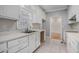 Kitchen with white cabinets and tile floors at 3542 Linecrest Rd, Ellenwood, GA 30294