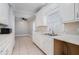 Kitchen with white cabinets, tile floors, and a window at 3542 Linecrest Rd, Ellenwood, GA 30294