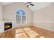 Living room with hardwood floors, fireplace and large window at 3542 Linecrest Rd, Ellenwood, GA 30294