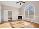 Living room featuring hardwood floors, fireplace, and large window at 3542 Linecrest Rd, Ellenwood, GA 30294