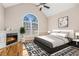 Spacious main bedroom with hardwood floors, fireplace, and large window at 3542 Linecrest Rd, Ellenwood, GA 30294