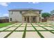 Large backyard with patio and grassy area at 6235 Stillwood Ln, Cumming, GA 30041