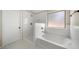 Bathroom with shower and bathtub at 6235 Stillwood Ln, Cumming, GA 30041