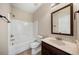 Clean bathroom with tub, toilet and vanity at 6235 Stillwood Ln, Cumming, GA 30041
