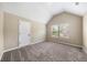 Spacious bedroom with window and carpet at 6235 Stillwood Ln, Cumming, GA 30041