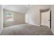Spacious bedroom with carpet and large window at 6235 Stillwood Ln, Cumming, GA 30041