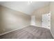 Spacious bedroom with neutral walls and carpet at 6235 Stillwood Ln, Cumming, GA 30041
