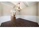 Formal dining room features hardwood floors and chandelier at 6235 Stillwood Ln, Cumming, GA 30041