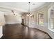 Bright dining room with wainscoting and large windows at 6235 Stillwood Ln, Cumming, GA 30041