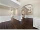 Two-story entryway with hardwood floors and white trim at 6235 Stillwood Ln, Cumming, GA 30041