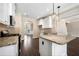 Kitchen with island, granite countertops and white cabinets at 6235 Stillwood Ln, Cumming, GA 30041