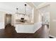 View of kitchen and foyer with open floor plan at 6235 Stillwood Ln, Cumming, GA 30041