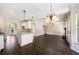 Open floor plan combining kitchen and Gathering room areas at 6235 Stillwood Ln, Cumming, GA 30041