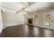 Spacious living room featuring a fireplace and dark tile floors at 6235 Stillwood Ln, Cumming, GA 30041