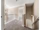 Upstairs hallway with carpet and white railings at 6235 Stillwood Ln, Cumming, GA 30041
