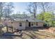 Ranch style home with brick and siding exterior, showcasing a patio and backyard at 2884 Santa Monica Dr, Decatur, GA 30032