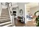 Grand two-story entryway with hardwood floors and a view to the living room at 2968 Winterthur Close Nw, Kennesaw, GA 30144