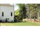 Side view of a two-story home showcasing a large white garage at 2968 Winterthur Close Nw, Kennesaw, GA 30144