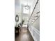 Charming powder room with a pedestal sink and wainscoting at 2968 Winterthur Close Nw, Kennesaw, GA 30144