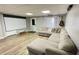 Finished basement with sectional sofa and projector at 2968 Winterthur Close Nw, Kennesaw, GA 30144