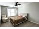 Spacious bedroom with plush carpet and ceiling fan at 2968 Winterthur Close Nw, Kennesaw, GA 30144