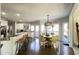 Open concept kitchen with island, breakfast nook, and hardwood floors at 2968 Winterthur Close Nw, Kennesaw, GA 30144