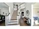 A grand two-story foyer with hardwood and carpeted stairs and decor throughout at 2968 Winterthur Close Nw, Kennesaw, GA 30144