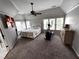 A spacious main bedroom featuring a large bed, lots of natural light, and an elliptical at 2968 Winterthur Close Nw, Kennesaw, GA 30144